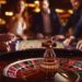 How do dealers clear chips after each spin in live roulette?